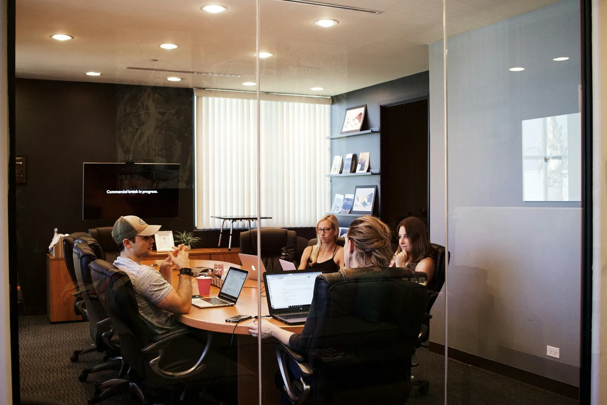 Colleagues reviewing work together at a table