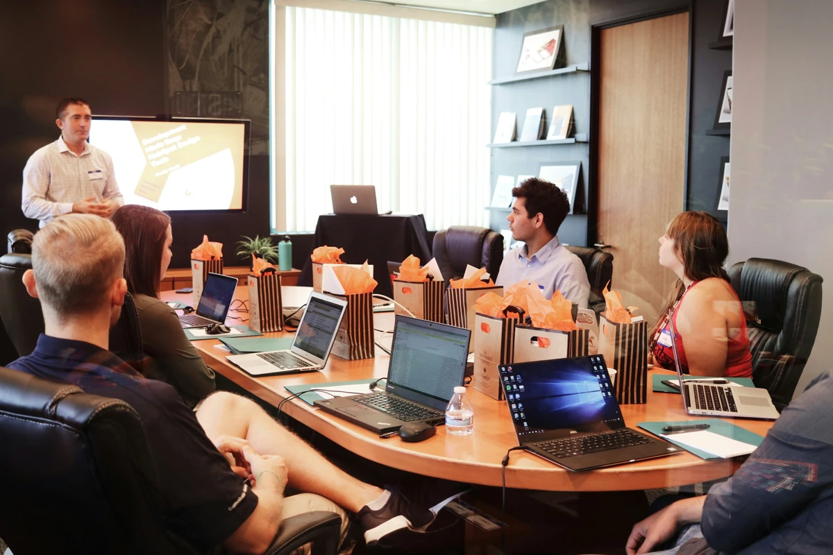 Team reviewing a presentation around a table