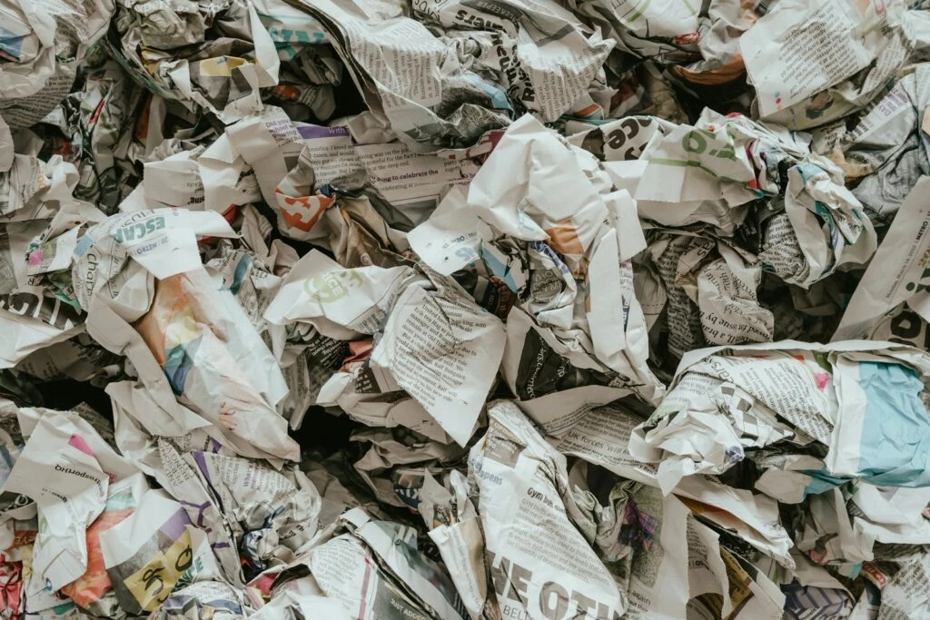 Crumpled newspapers and discarded printed paper
