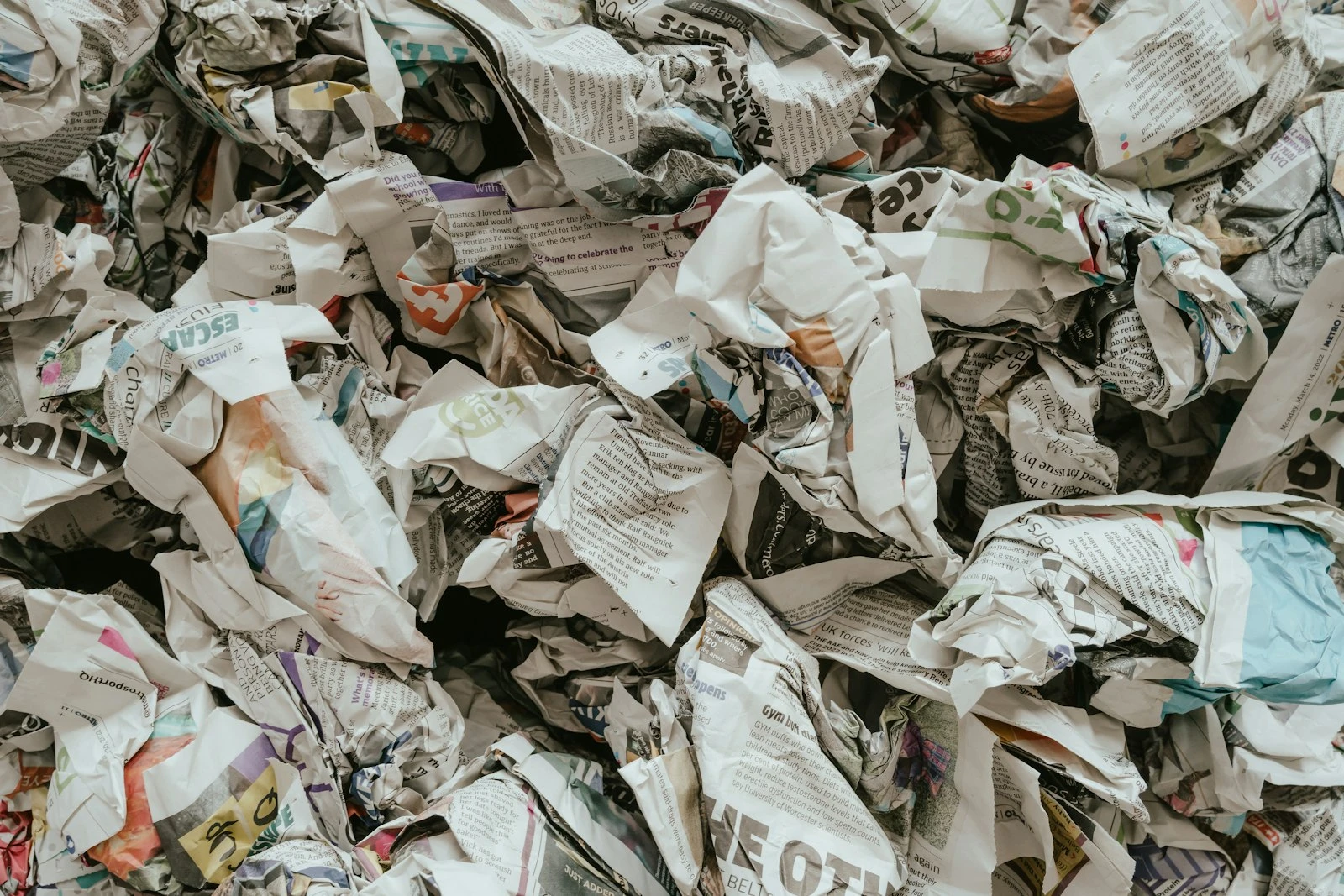 Crumpled newspapers and discarded printed paper