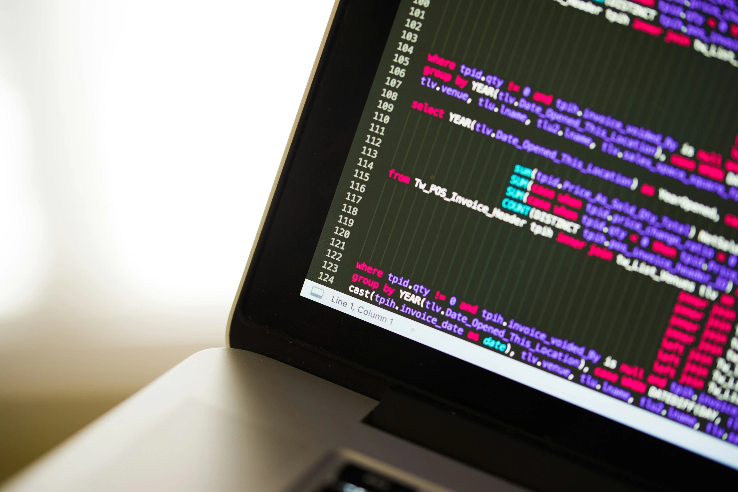 Laptop showing syntax-highlighted source code